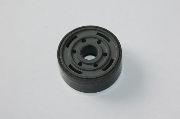 Glass fiber and MoS2 filled PTFE banded shock piston with low friction